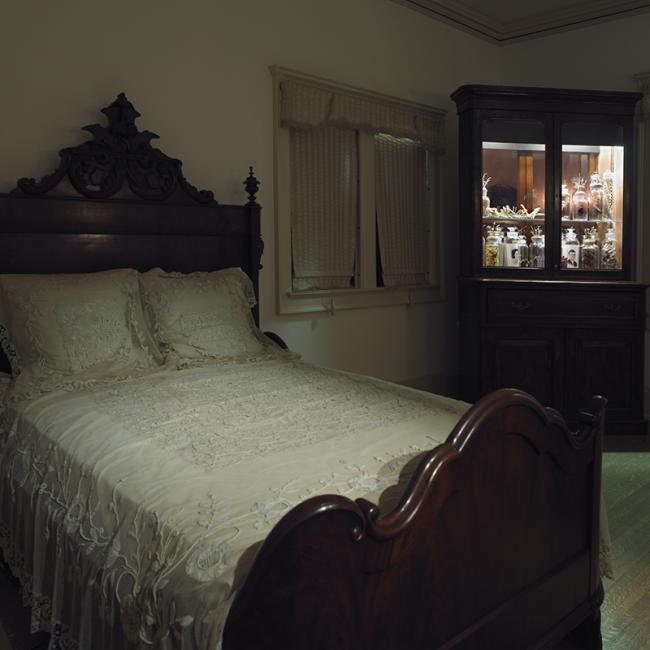 Echoes_view with victorian bedstead and cabinet